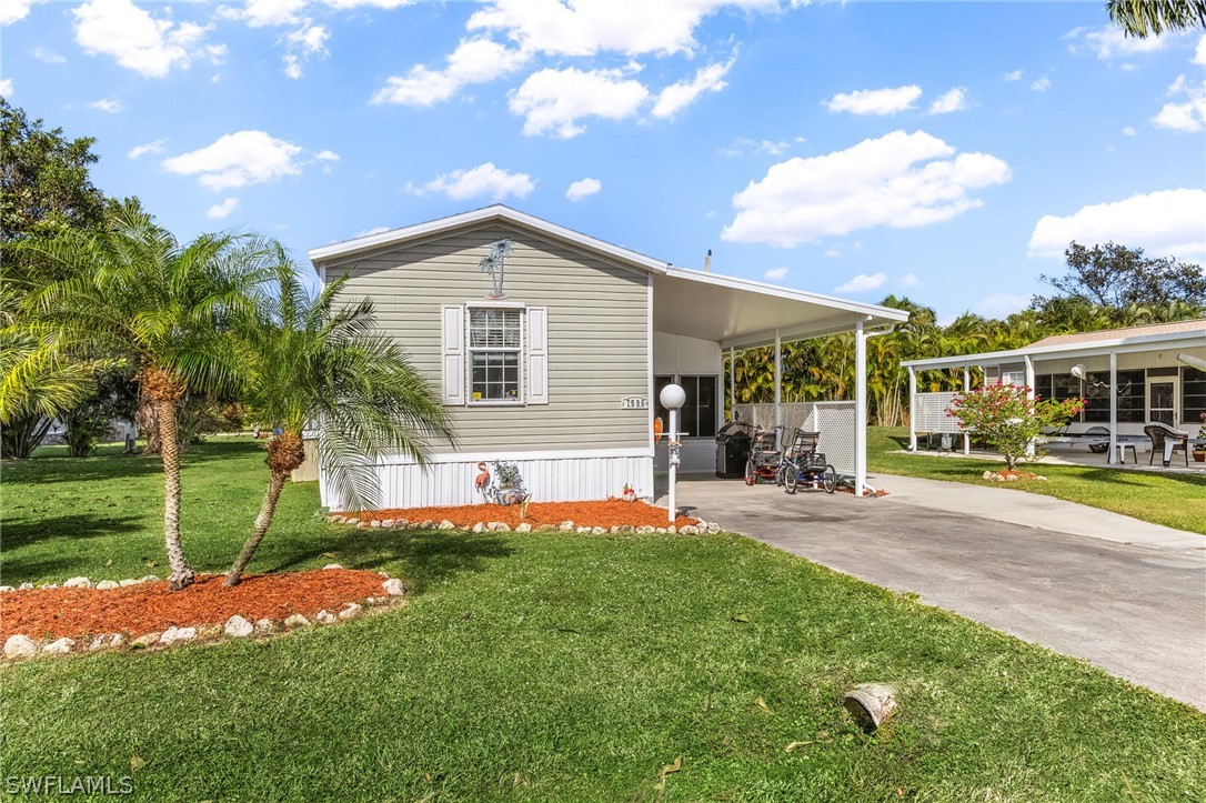 a front view of house with yard and green space