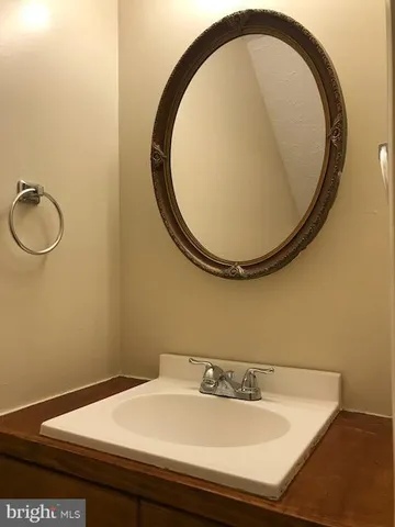 a bathroom with a sink and mirror