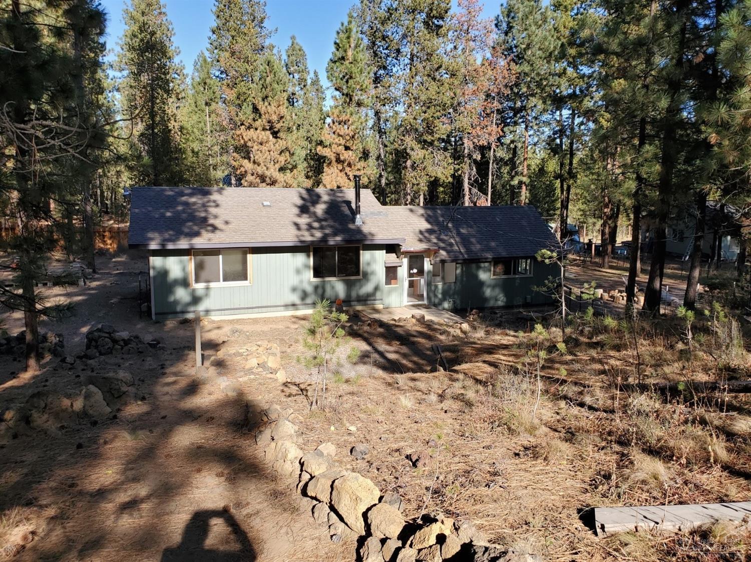 16860 Jacinto Road Bend, OR 97707 - Photo 1 of 24 a view of a house with a yard covered with snow