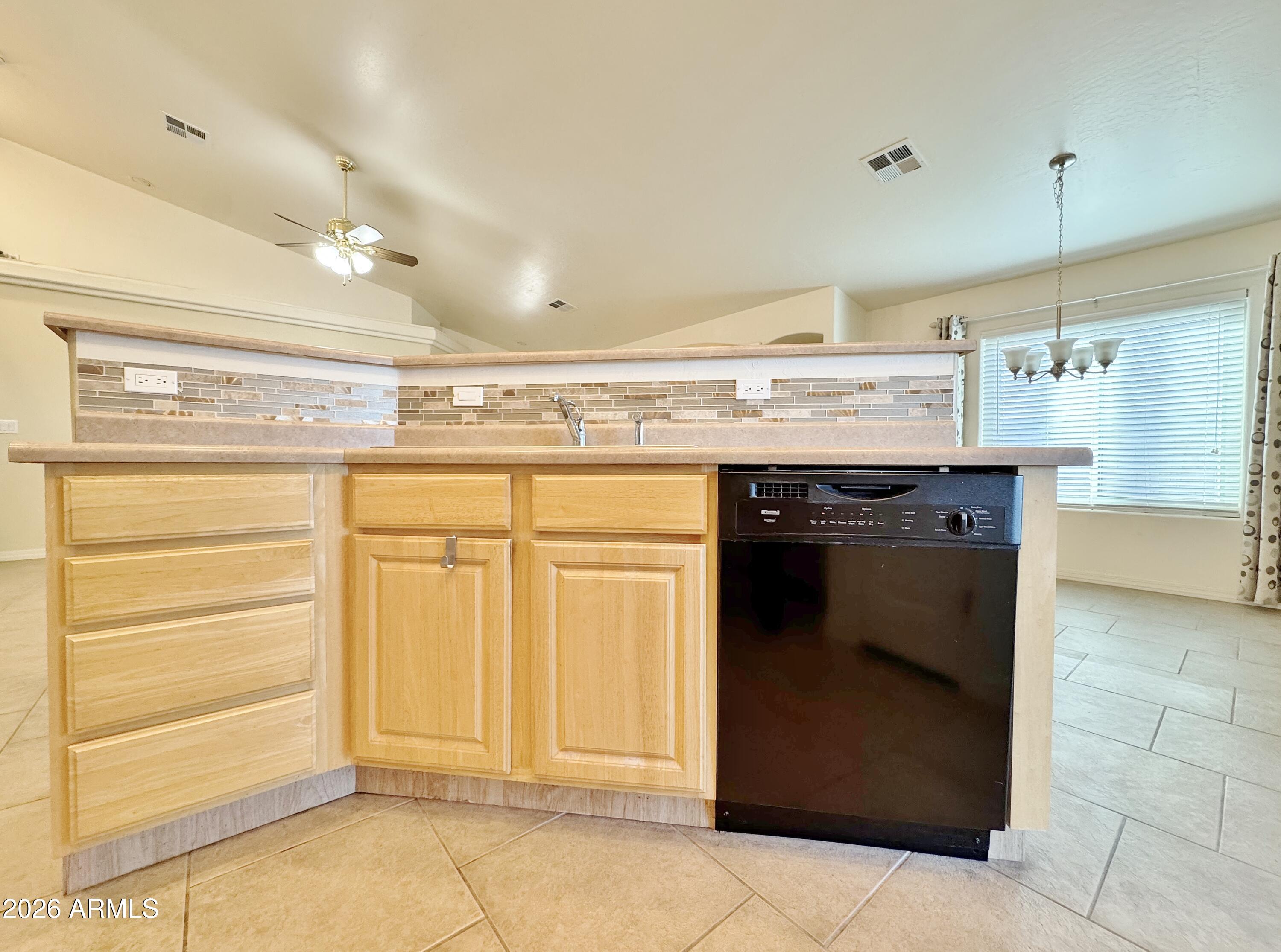 15774 South Saxon Road Arizona City, AZ 85123 - Photo 15 of 53 a kitchen with a sink and cabinets