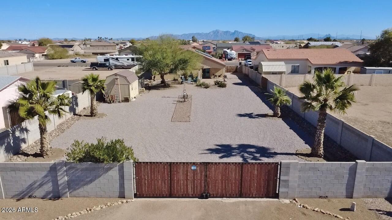 15774 South Saxon Road Arizona City, AZ 85123 - Photo 2 of 53 an aerial view of a house with a yard