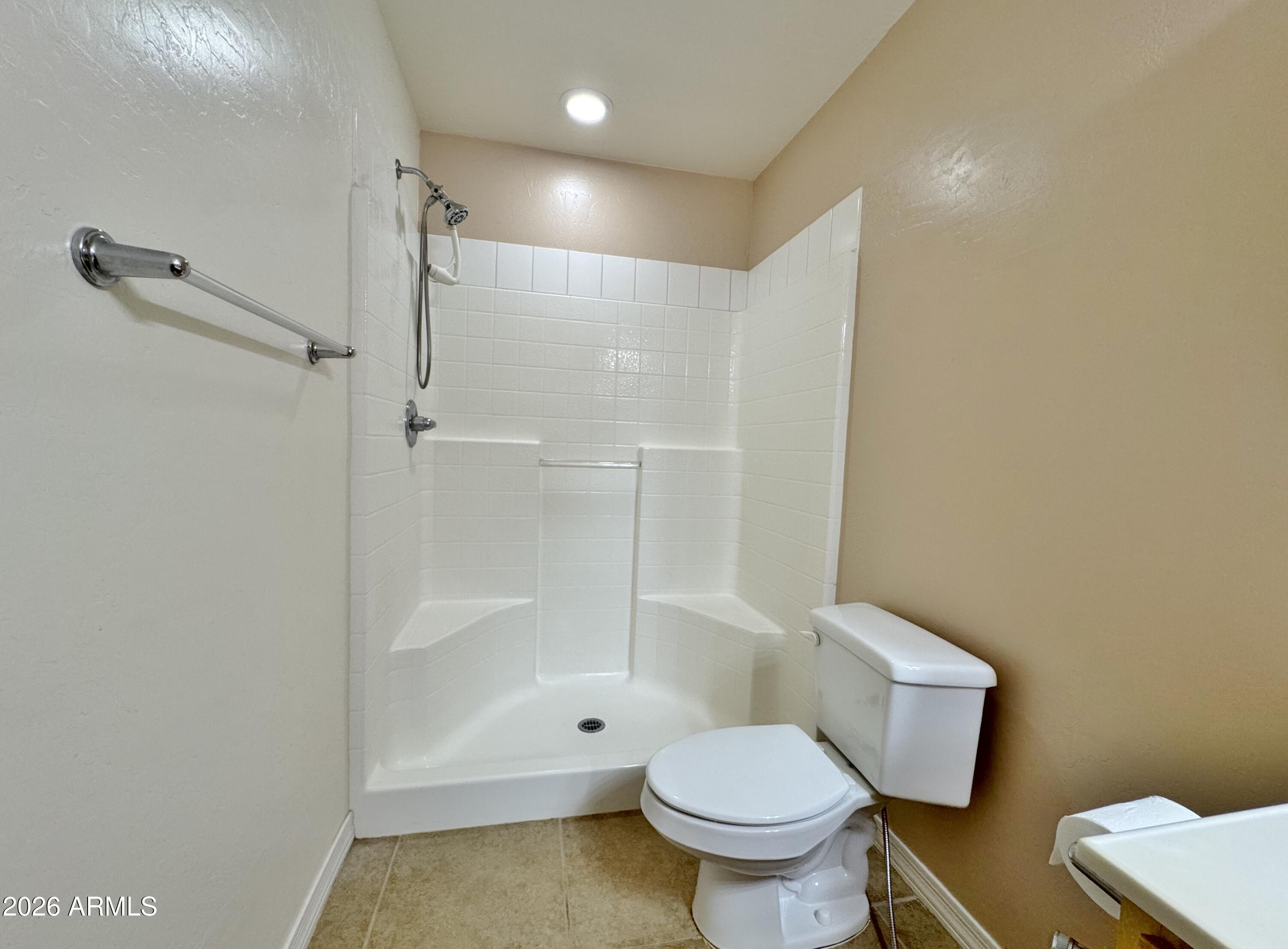 15774 South Saxon Road Arizona City, AZ 85123 - Photo 23 of 53 a bathroom with a toilet and a shower