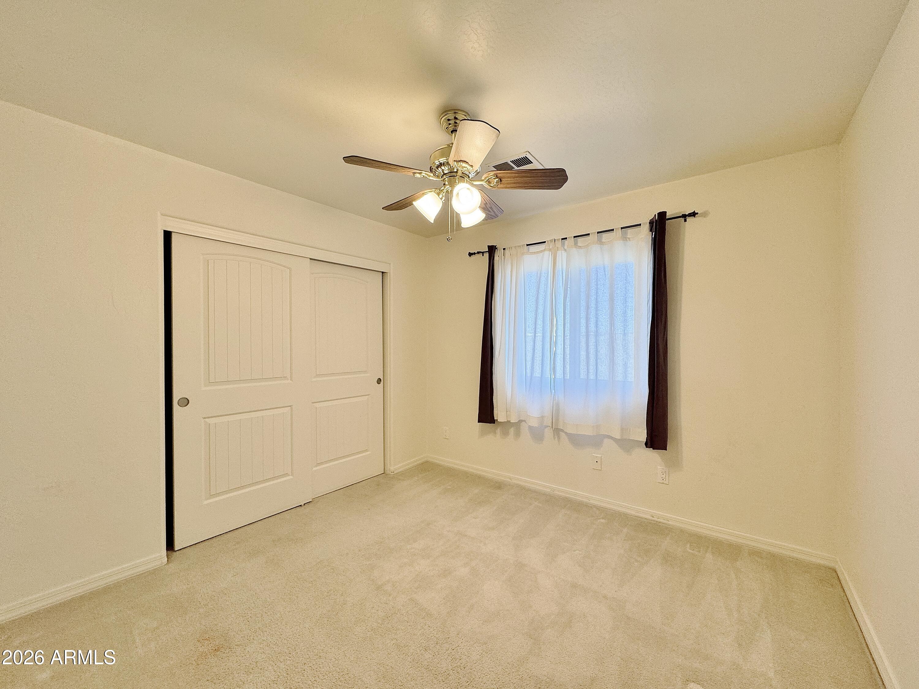 15774 South Saxon Road Arizona City, AZ 85123 - Photo 24 of 53 a view of an empty room with a window
