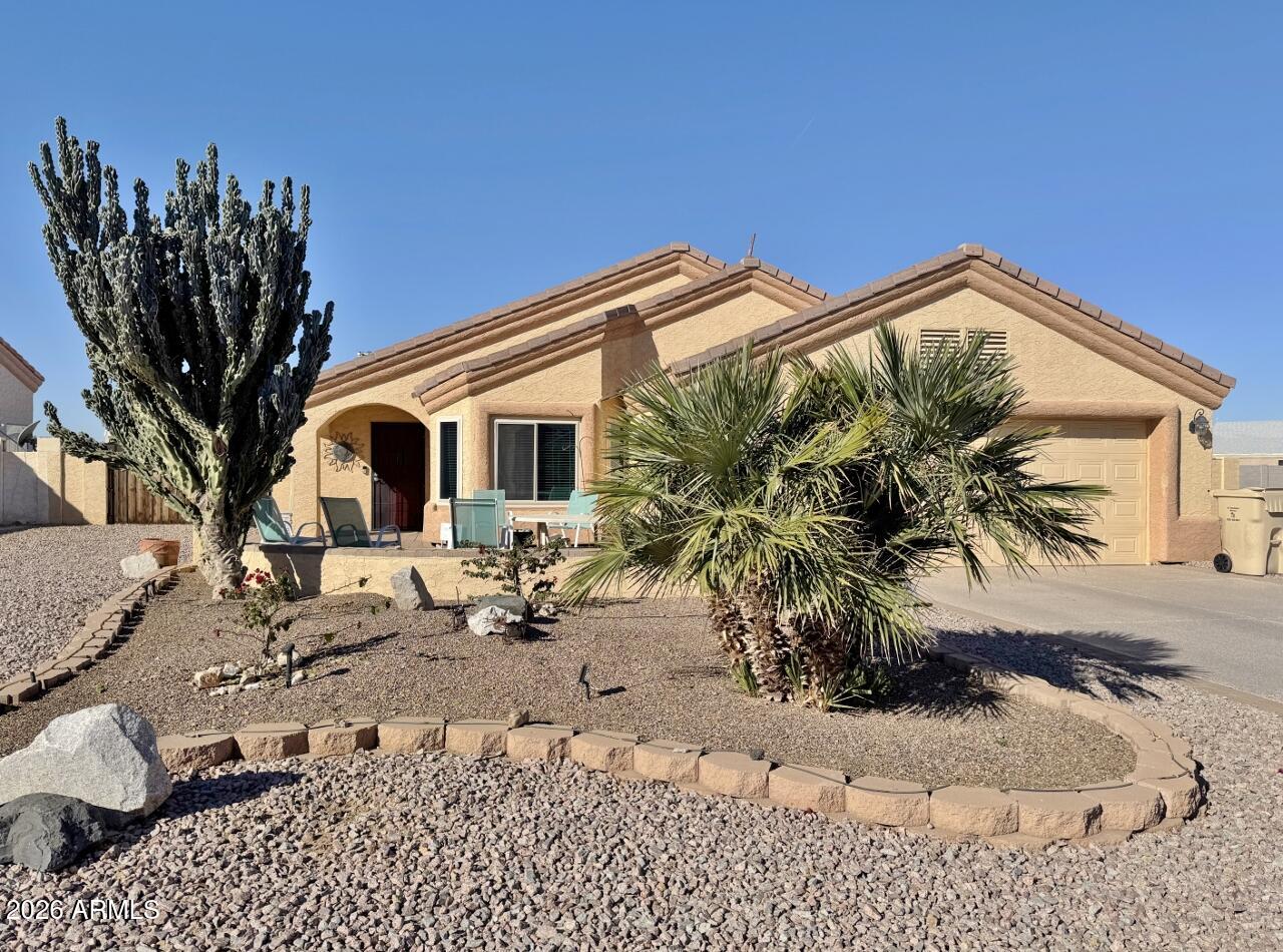 15774 South Saxon Road Arizona City, AZ 85123 - Photo 3 of 53 a view of a house with a patio