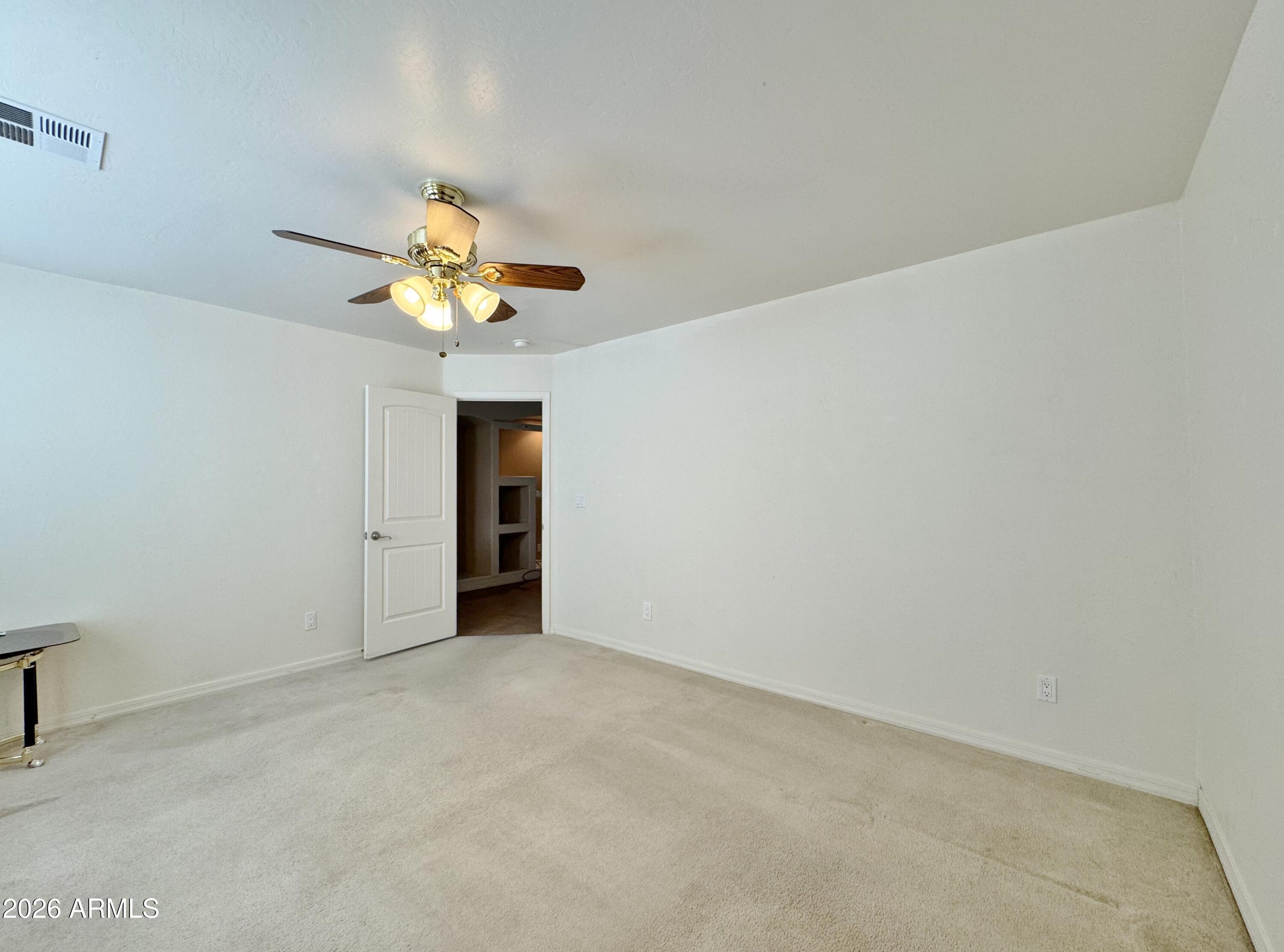 15774 South Saxon Road Arizona City, AZ 85123 - Photo 32 of 53 a view of an empty room with a window