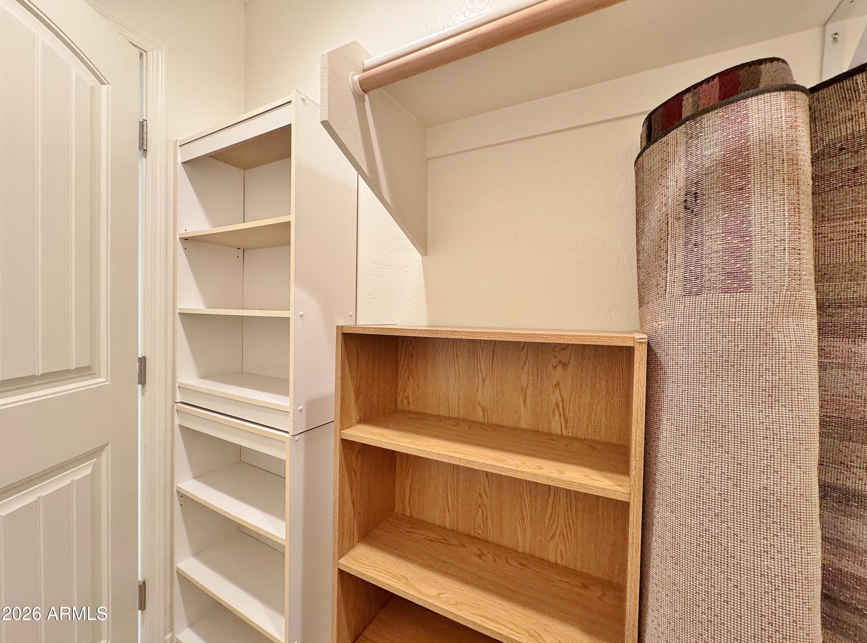 15774 South Saxon Road Arizona City, AZ 85123 - Photo 35 of 53 a view of walk in closet with empty racks