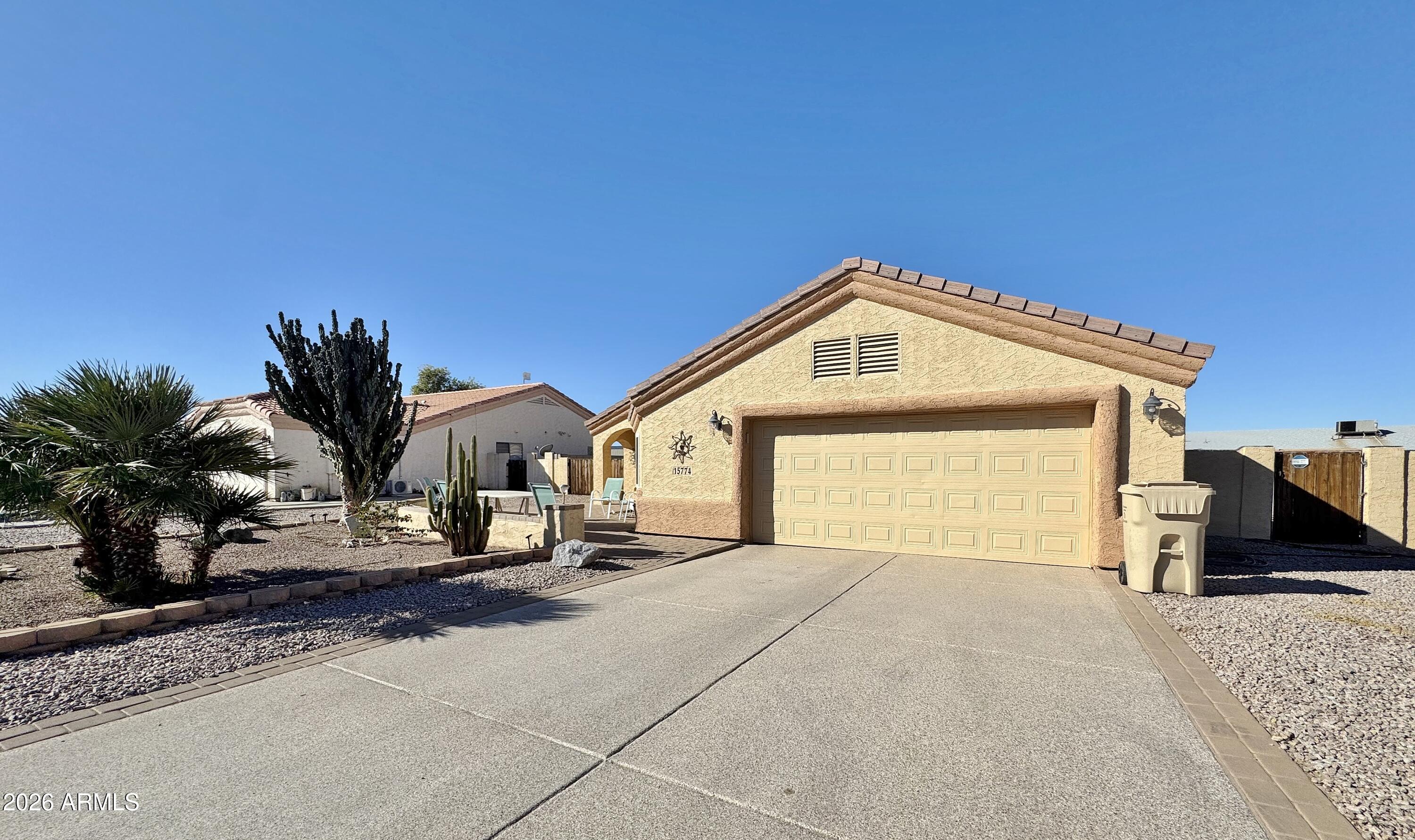 15774 South Saxon Road Arizona City, AZ 85123 - Photo 4 of 53 a view of a house with a outdoor space