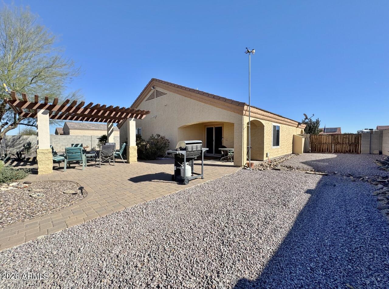 15774 South Saxon Road Arizona City, AZ 85123 - Photo 42 of 53 a view of a house with backyard and sitting area