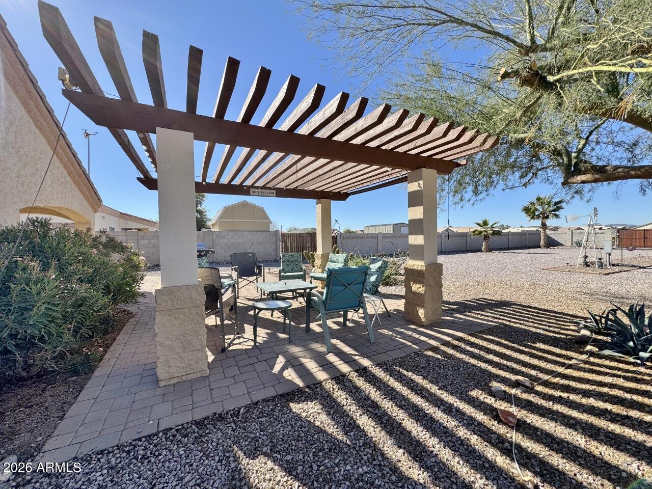 15774 South Saxon Road Arizona City, AZ 85123 - Photo 44 of 53 a view of a patio with table and chairs with wooden floor and plants