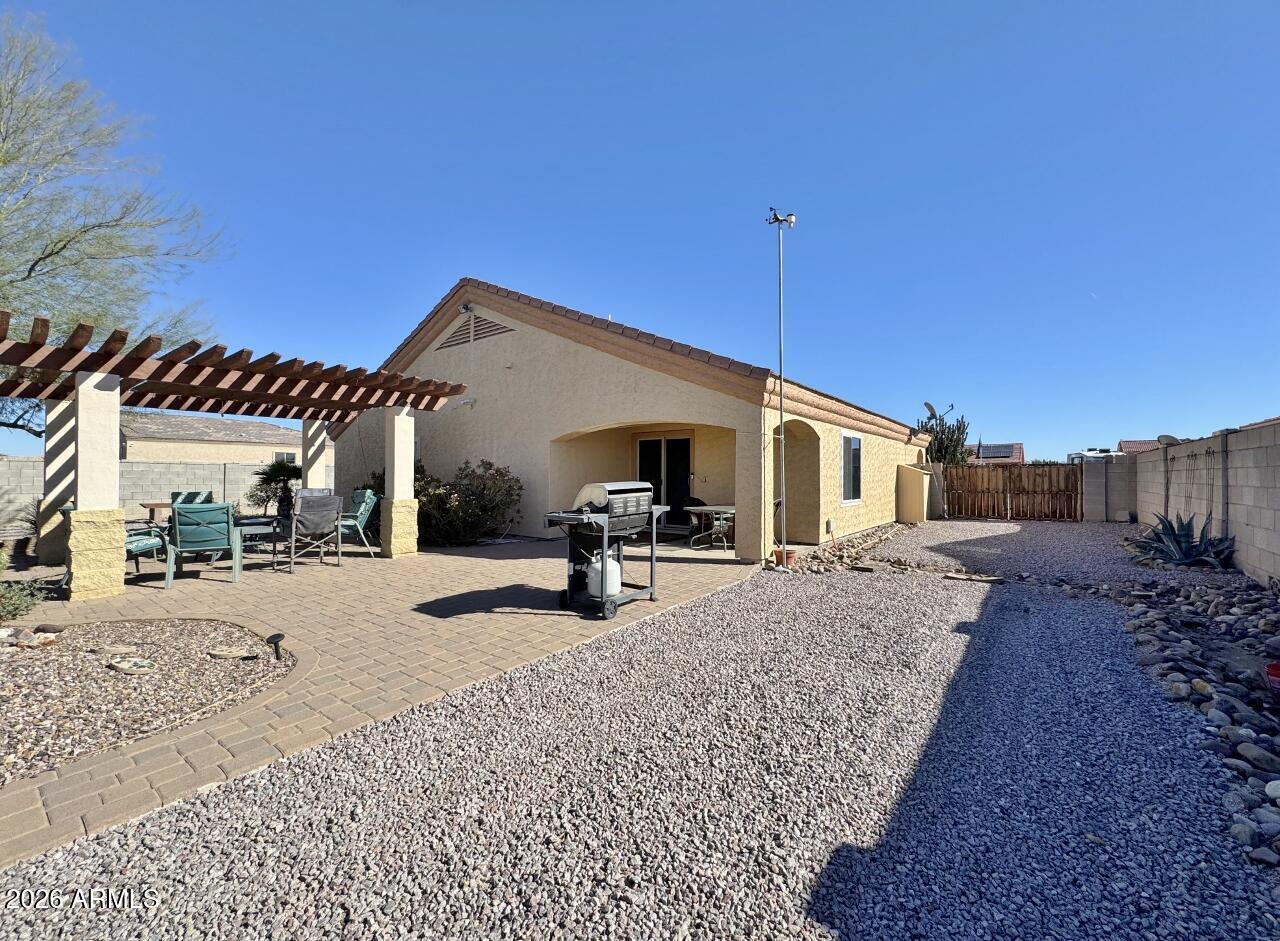 15774 South Saxon Road Arizona City, AZ 85123 - Photo 45 of 53 a view of a house with backyard and sitting area