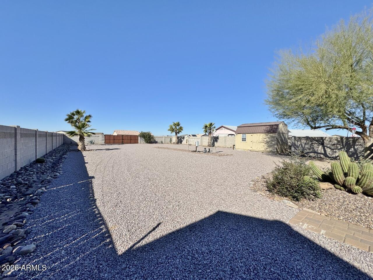 15774 South Saxon Road Arizona City, AZ 85123 - Photo 47 of 53 a view of a house with a backyard