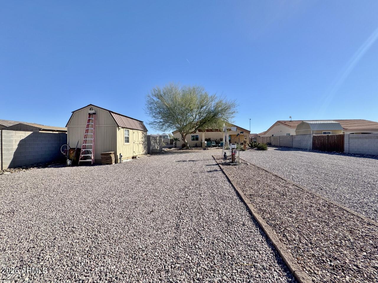 15774 South Saxon Road Arizona City, AZ 85123 - Photo 49 of 53 a front view of a house with a yard