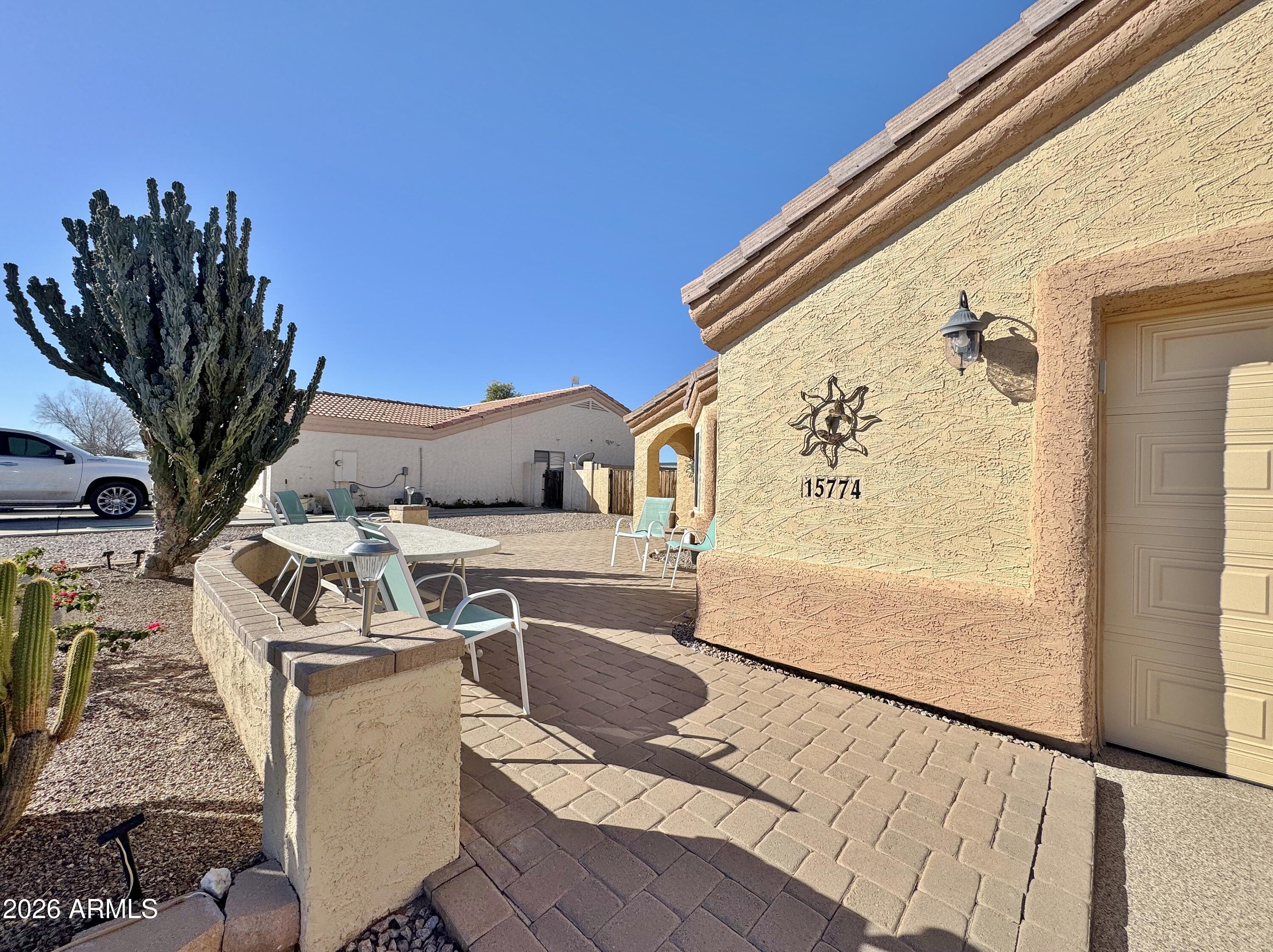 15774 South Saxon Road Arizona City, AZ 85123 - Photo 5 of 53 a balcony with table and chairs