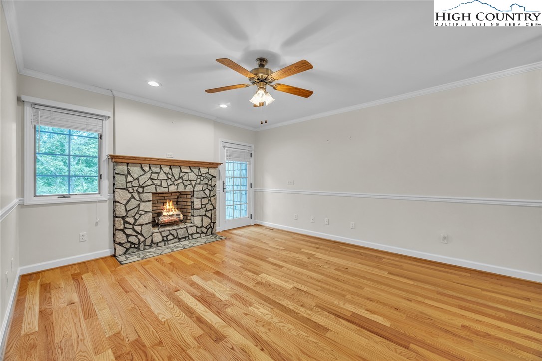 1515 Clifton Road Crumpler, NC 28617 - Photo 11 of 23 an empty room with windows and fireplace