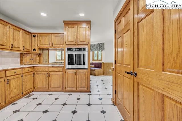 a view of a kitchen with electric appliances