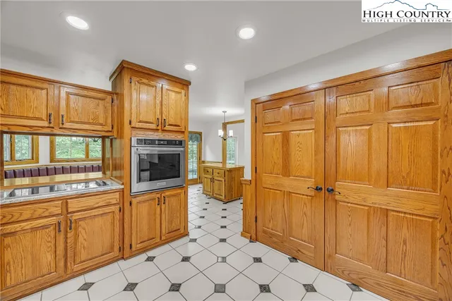a view of a kitchen with electric appliances