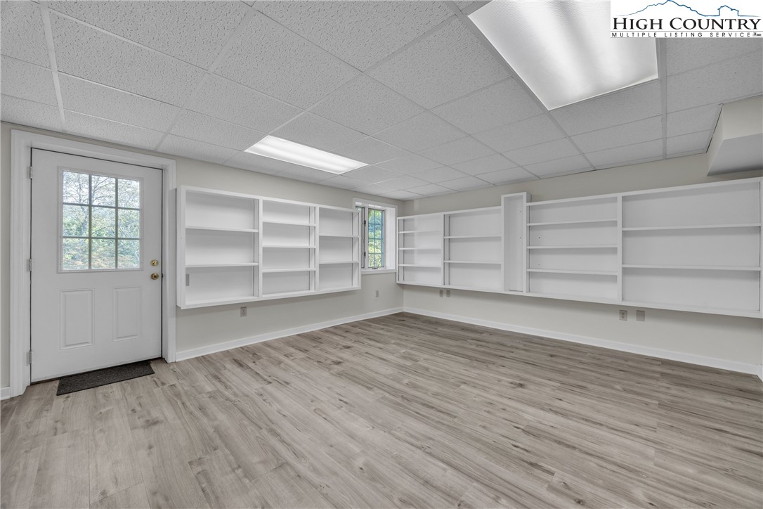 1515 Clifton Road Crumpler, NC 28617 - Photo 18 of 23 wooden floor in an empty room with a window