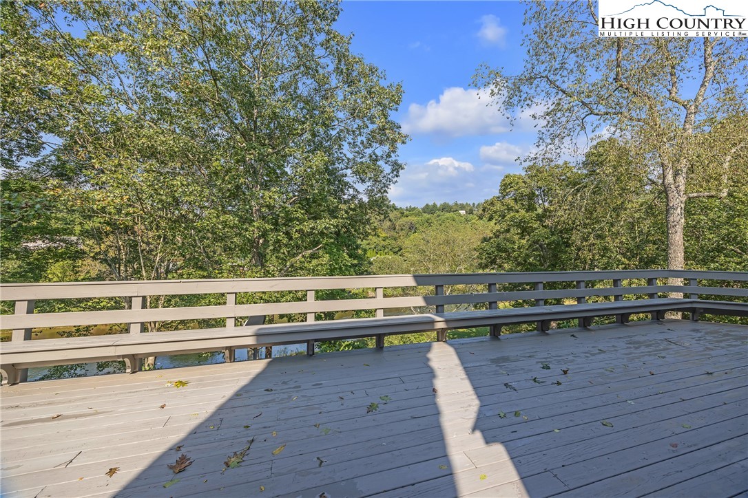 1515 Clifton Road Crumpler, NC 28617 - Photo 20 of 23 a view of a balcony with wooden floor and fence