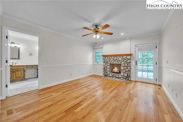 wooden floor in an empty room with a fireplace
