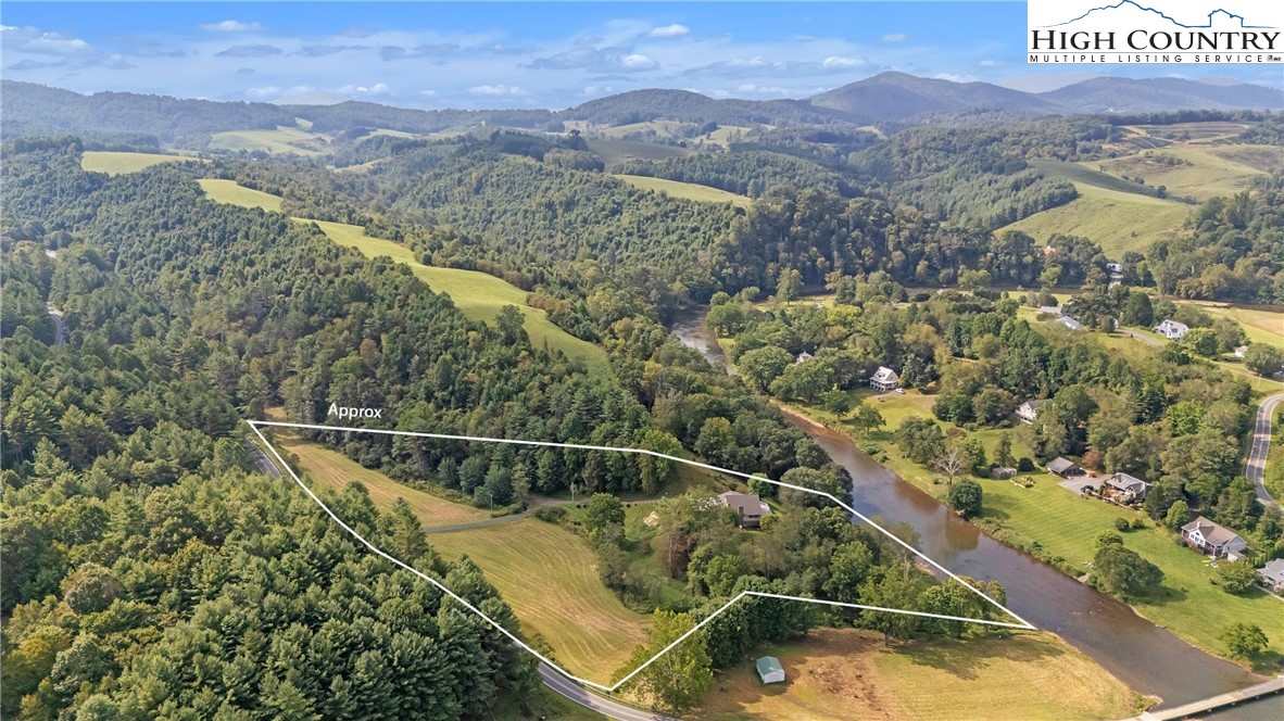 1515 Clifton Road Crumpler, NC 28617 - Photo 22 of 23 a view of a swimming pool with a yard