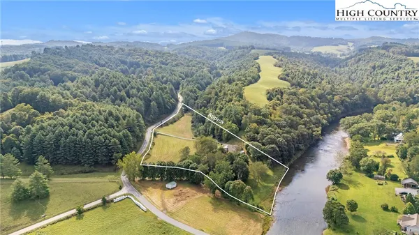 a view of a swimming pool with a yard and mountain view