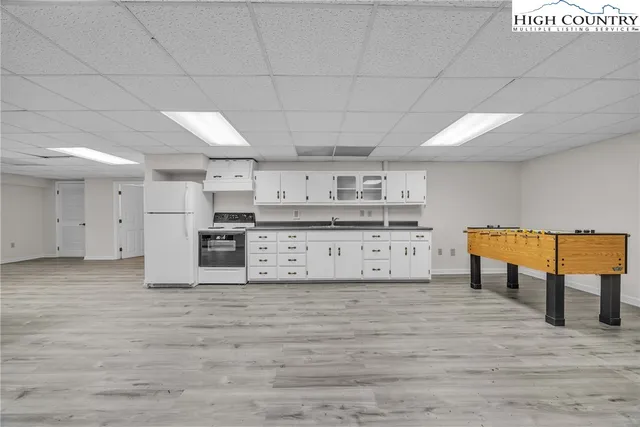 a kitchen with stainless steel appliances kitchen island granite countertop a stove and a cabinets