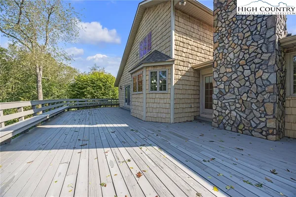 a view of wooden floor with a bench
