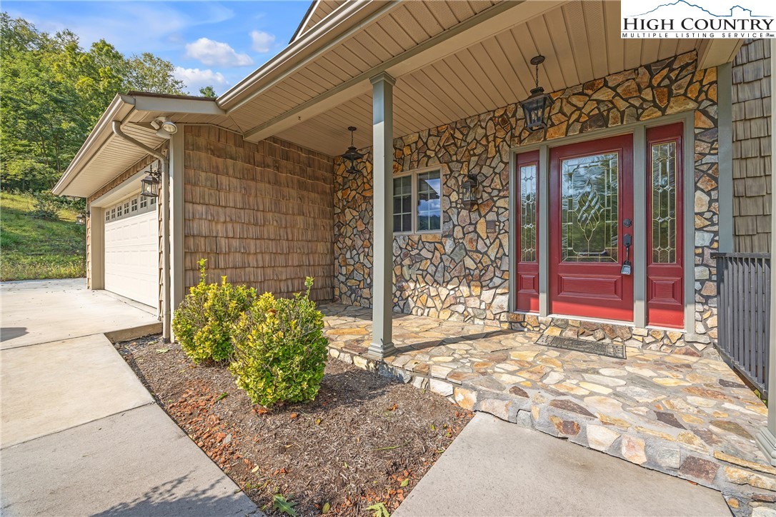 1515 Clifton Road Crumpler, NC 28617 - Photo 7 of 23 a view of a house with a outdoor space