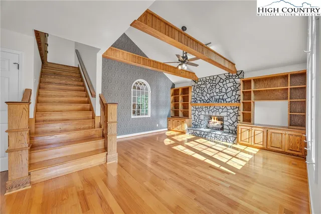 a view of livingroom with furniture and staircase