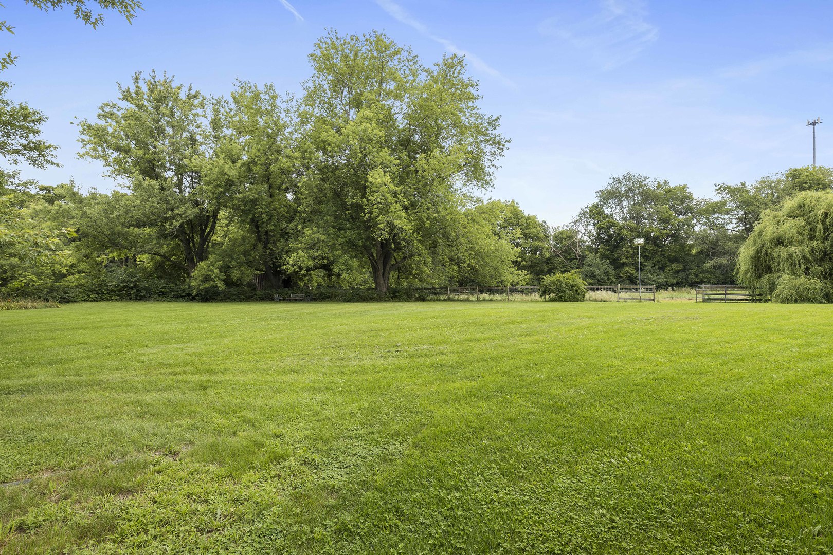 1010 Sunset Road Spring Grove, IL 60081 - Photo 13 of 40 a view of a field with trees in the background