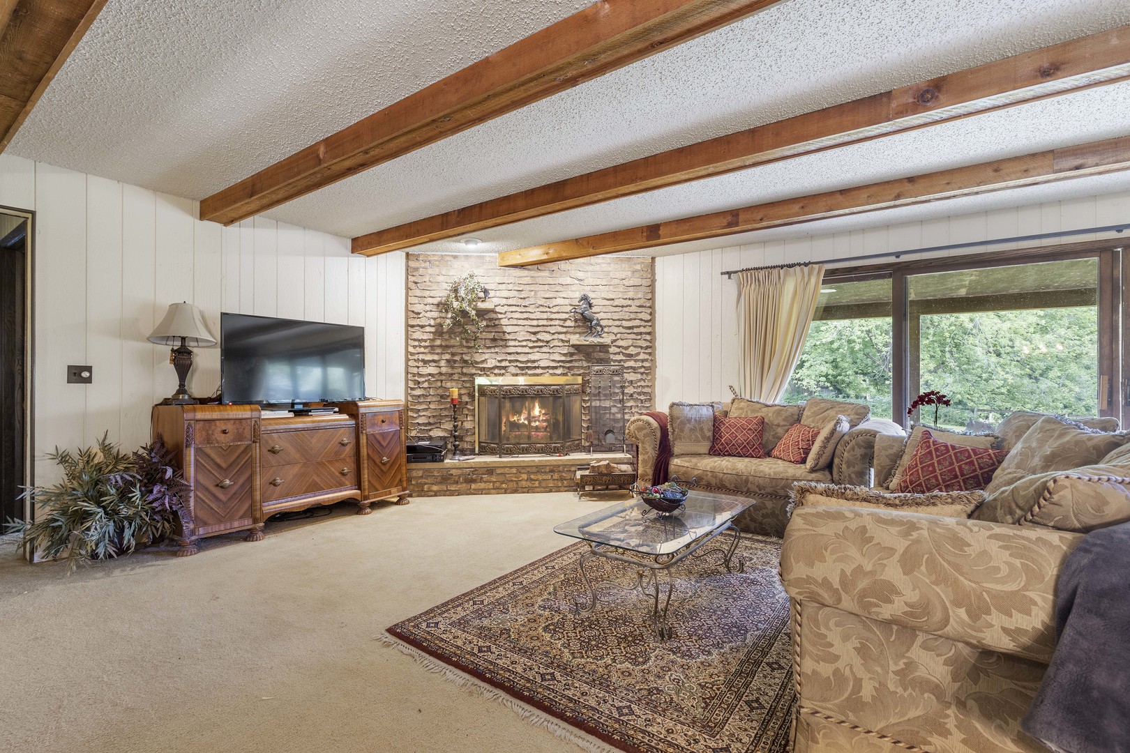 1010 Sunset Road Spring Grove, IL 60081 - Photo 20 of 40 a living room with furniture and a large window