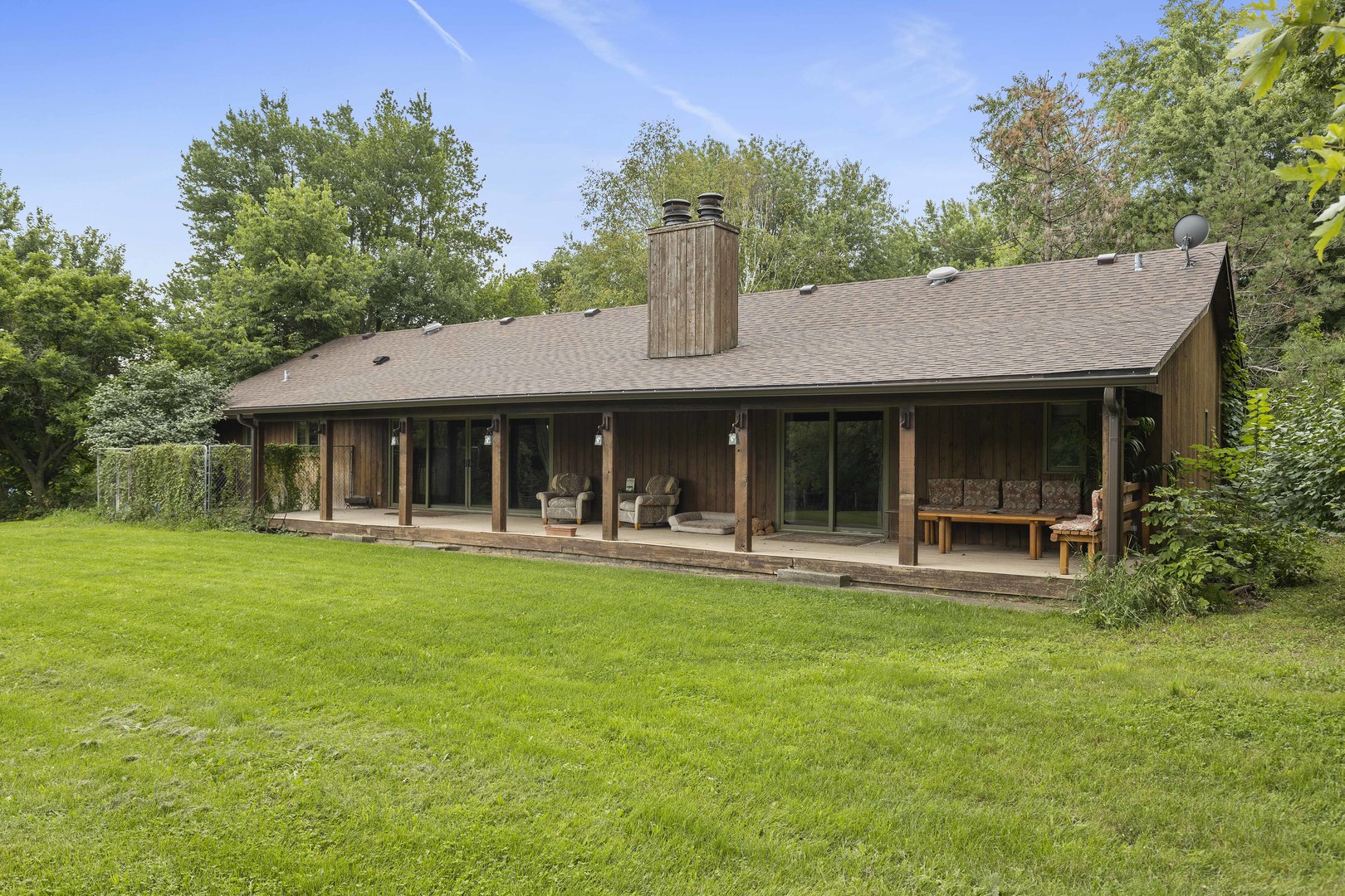 1010 Sunset Road Spring Grove, IL 60081 - Photo 3 of 40 a front view of a house with swimming pool and furniture