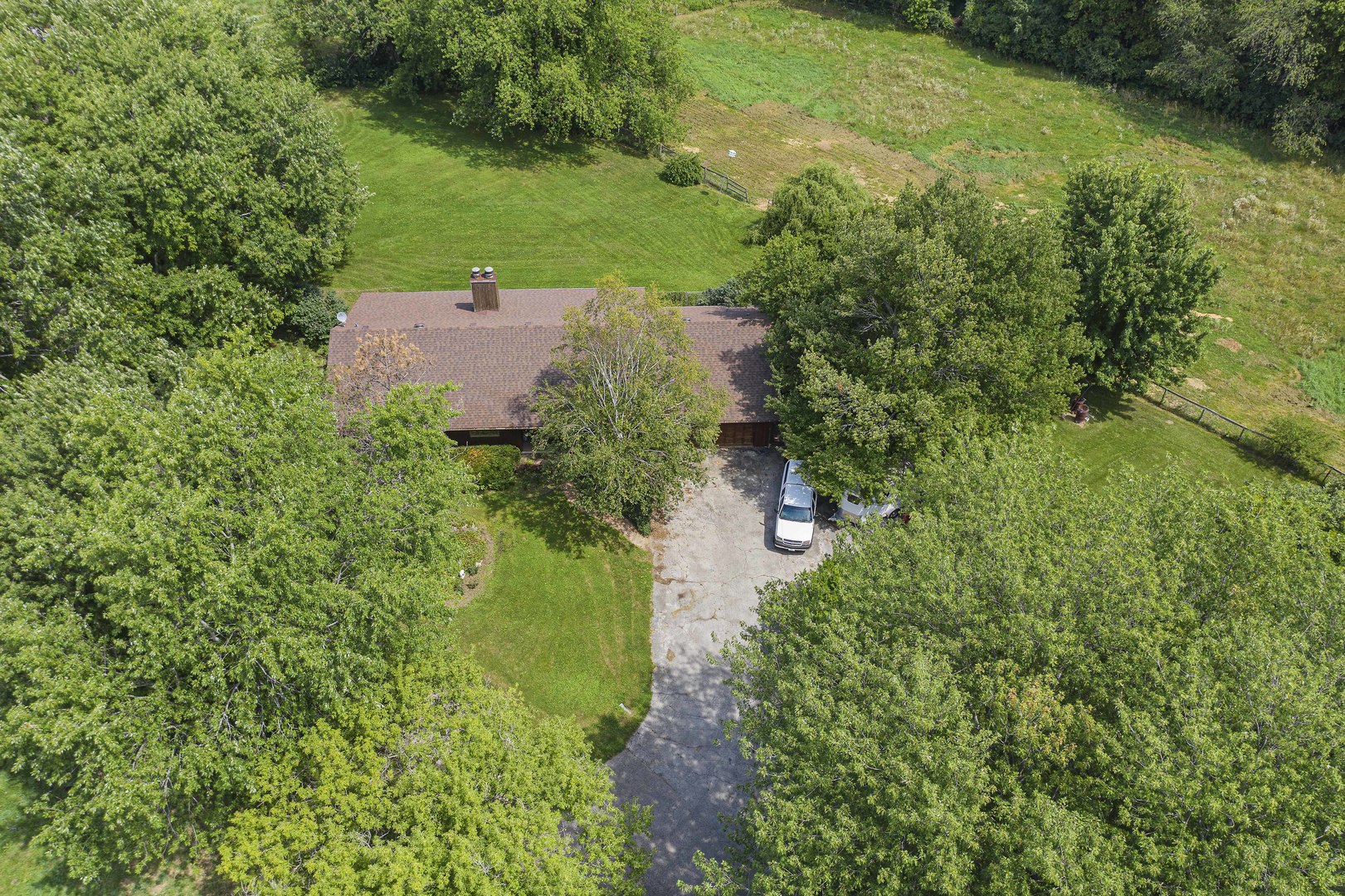 1010 Sunset Road Spring Grove, IL 60081 - Photo 7 of 40 an aerial view of residential house with outdoor space and trees all around