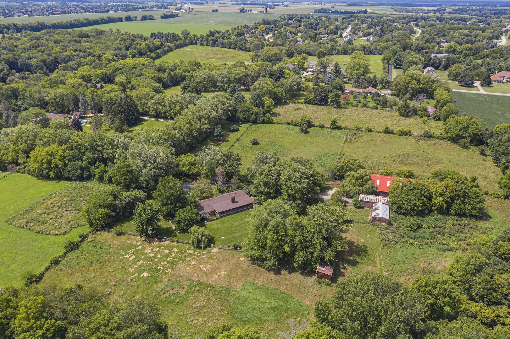 1010 Sunset Road Spring Grove, IL 60081 - Photo 8 of 40 an aerial view of residential houses with outdoor space and trees