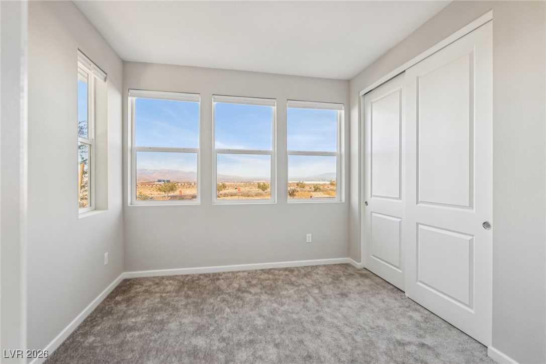 3338 Esker Rdg Avenue Henderson, NV 89044 - Photo 23 of 84 Unfurnished bedroom with carpet, multiple windows, and a closet
