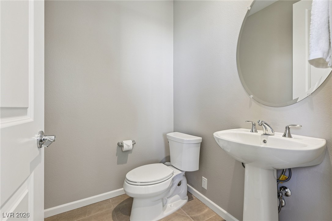 3338 Esker Rdg Avenue Henderson, NV 89044 - Photo 28 of 84 Bathroom featuring toilet and light tile patterned flooring