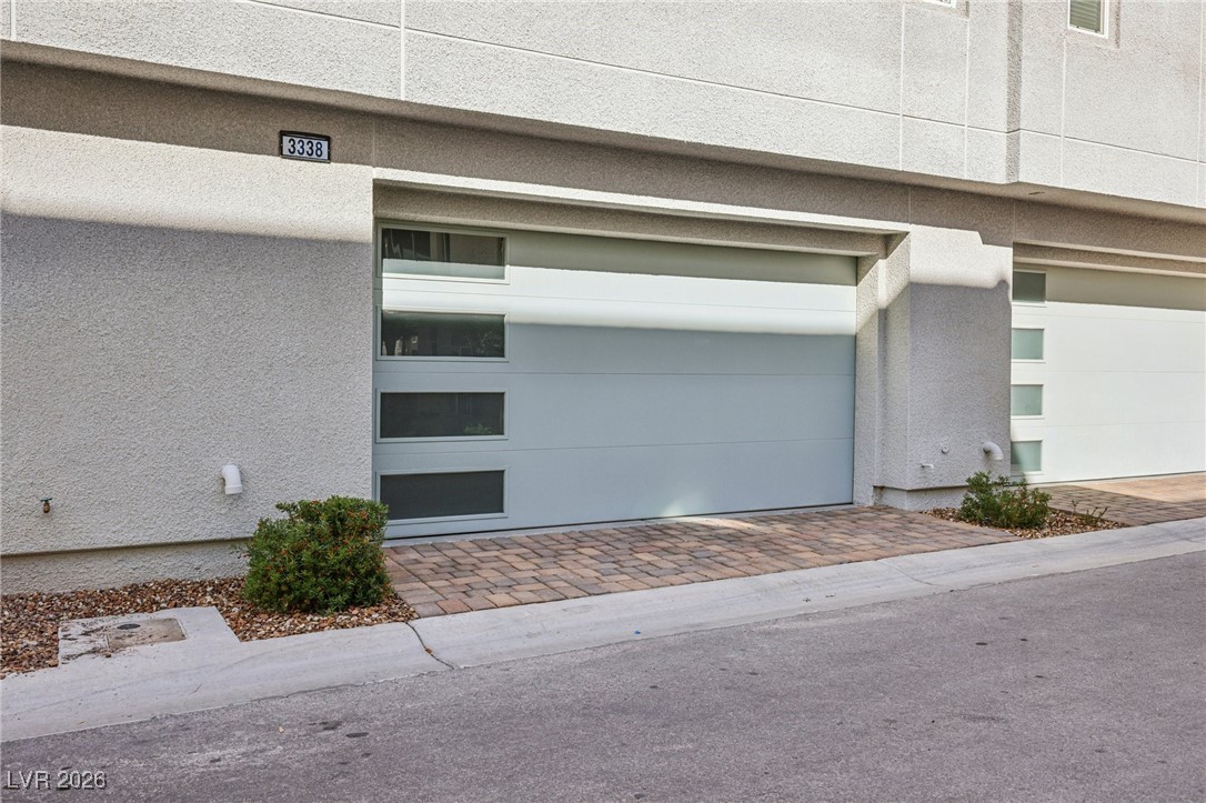 3338 Esker Rdg Avenue Henderson, NV 89044 - Photo 3 of 84 Garage with decorative driveway