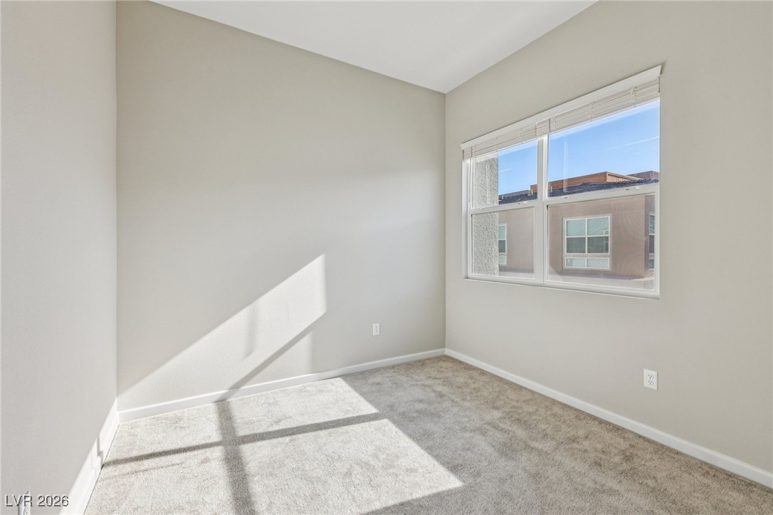 3338 Esker Rdg Avenue Henderson, NV 89044 - Photo 40 of 84 Unfurnished room with light carpet and baseboards