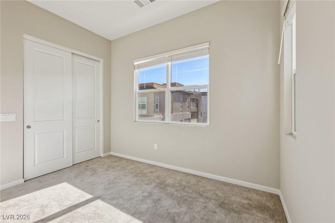 3338 Esker Rdg Avenue Henderson, NV 89044 - Photo 44 of 84 Unfurnished bedroom with a closet and carpet flooring