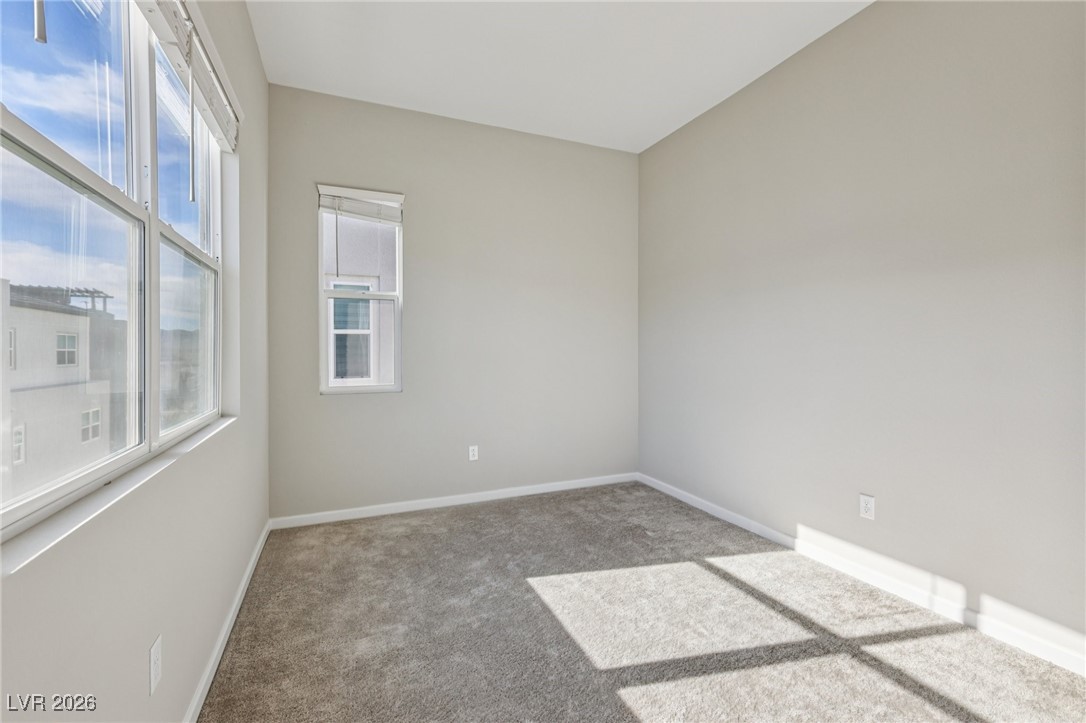 3338 Esker Rdg Avenue Henderson, NV 89044 - Photo 45 of 84 Empty room featuring carpet flooring and baseboards