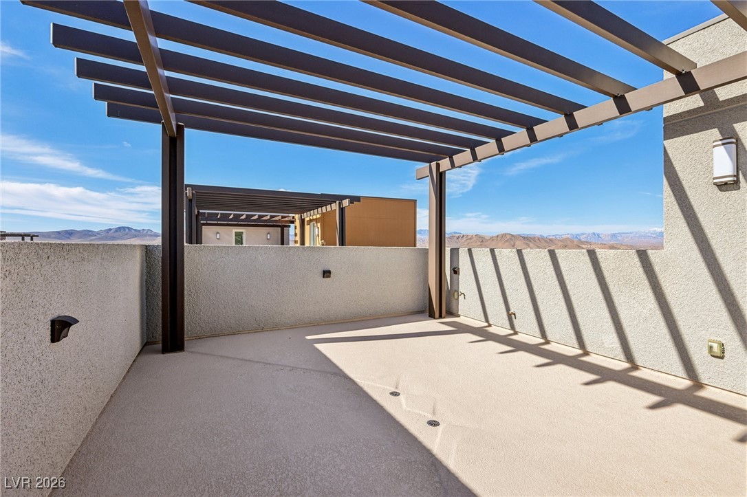 3338 Esker Rdg Avenue Henderson, NV 89044 - Photo 59 of 84 View of patio / terrace featuring a mountain view and a pergola