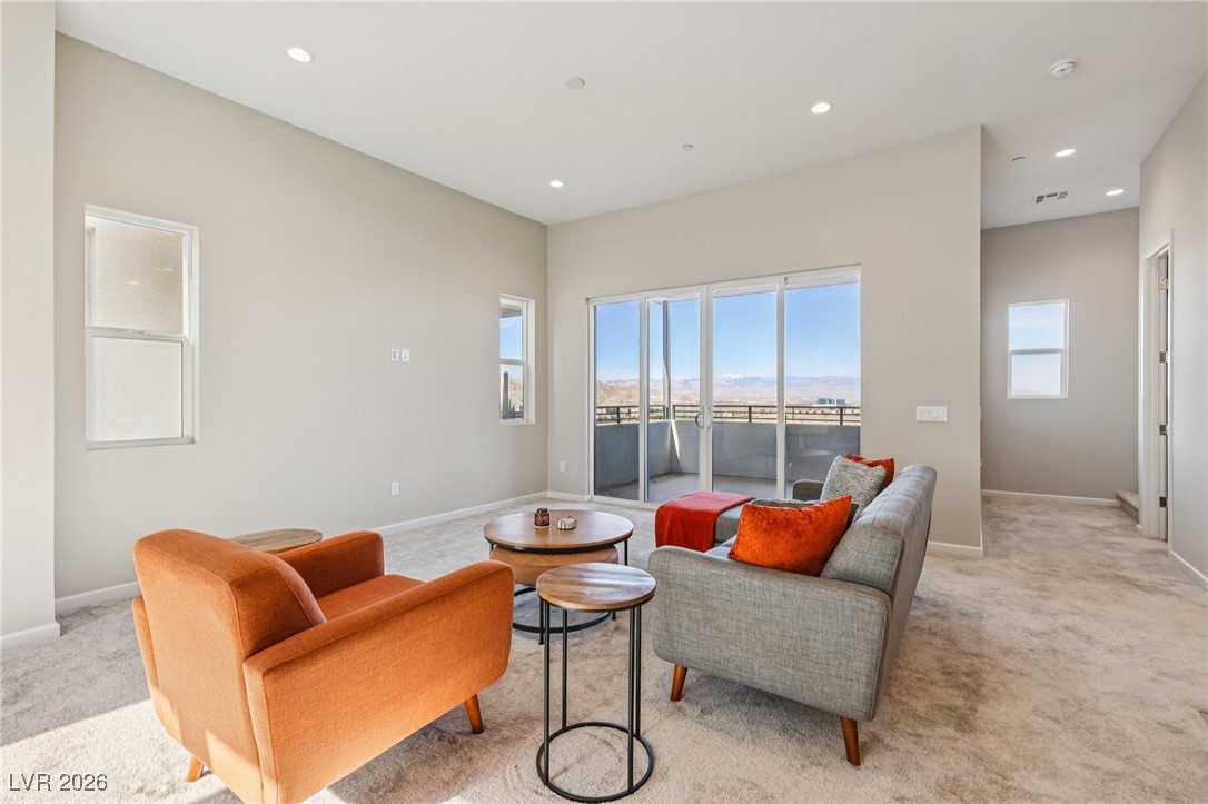 3338 Esker Rdg Avenue Henderson, NV 89044 - Photo 8 of 84 Living room featuring light colored carpet and recessed lighting