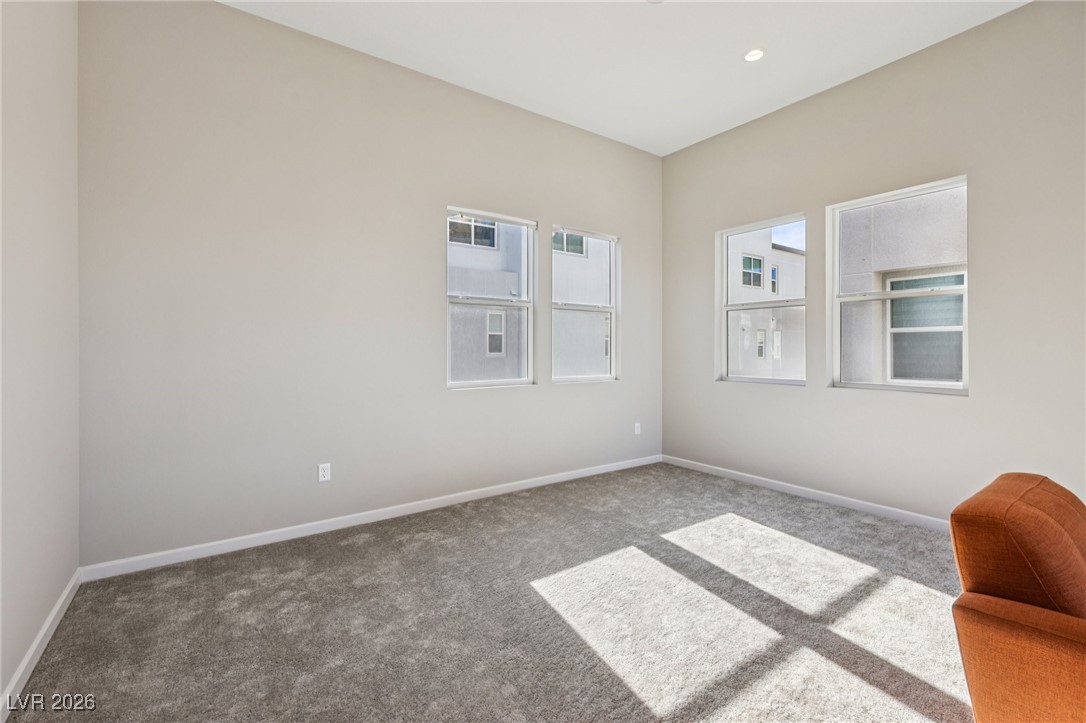 3338 Esker Rdg Avenue Henderson, NV 89044 - Photo 9 of 84 Empty room featuring baseboards and carpet