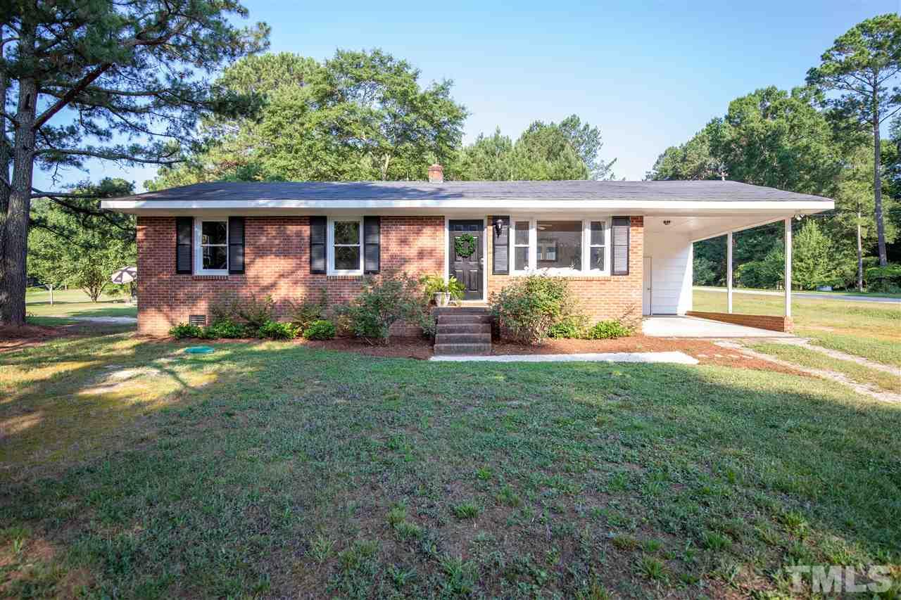 4005 Lizard Lick Road Wendell, NC 27591 - Photo 1 of 25 a view of a house with backyard and garden