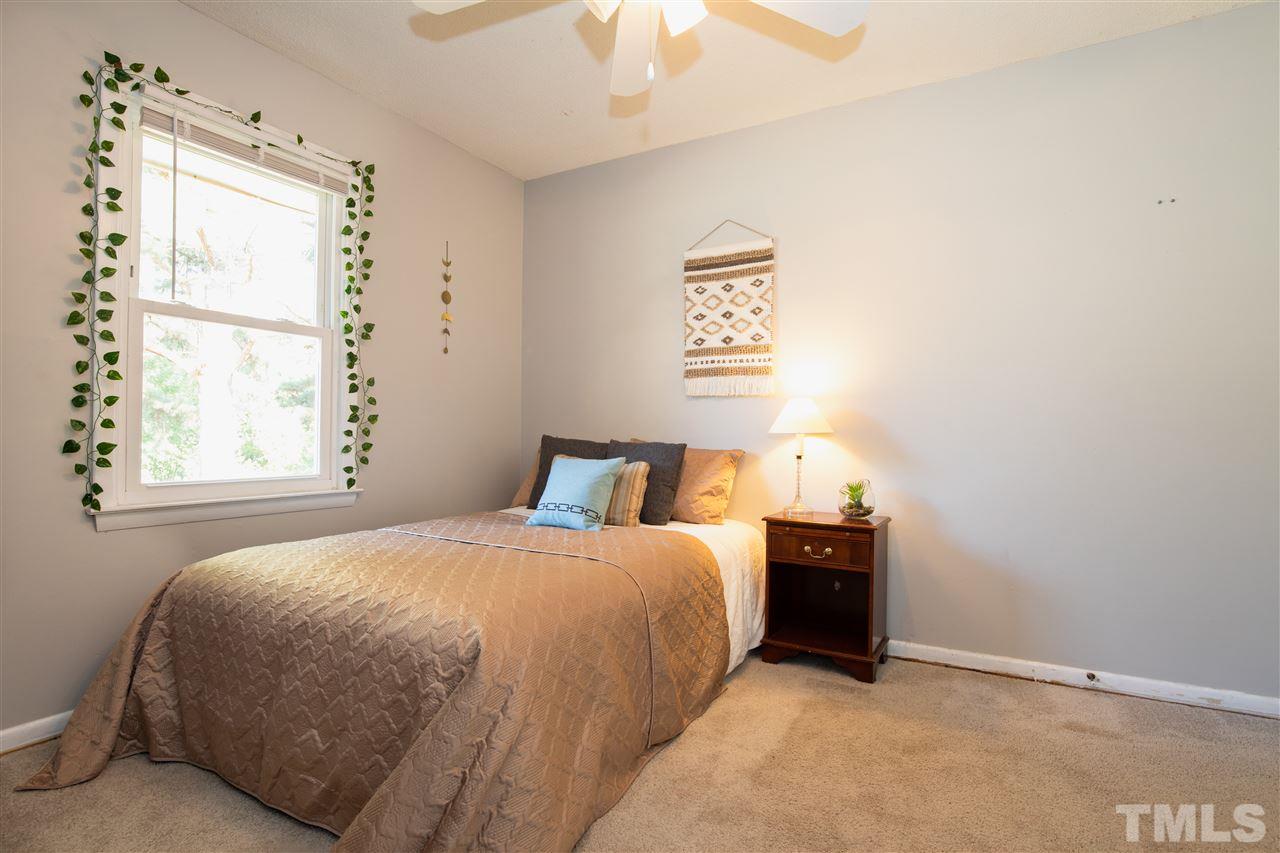 4005 Lizard Lick Road Wendell, NC 27591 - Photo 11 of 25 a bedroom with a bed and a window