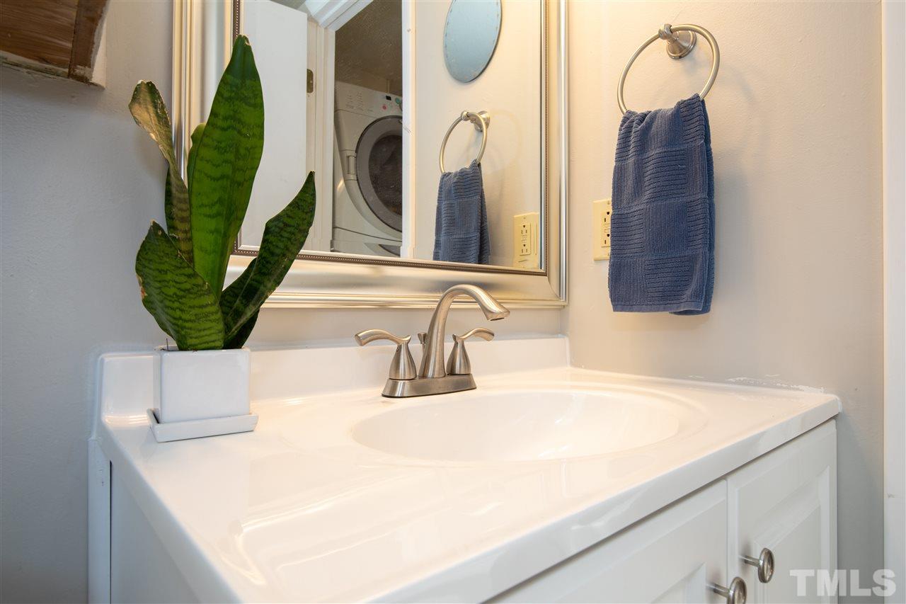 4005 Lizard Lick Road Wendell, NC 27591 - Photo 14 of 25 a bathroom with a sink and a mirror