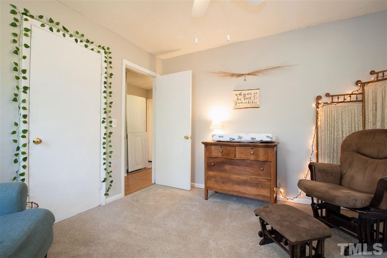4005 Lizard Lick Road Wendell, NC 27591 - Photo 7 of 25 a room with furniture and a chair
