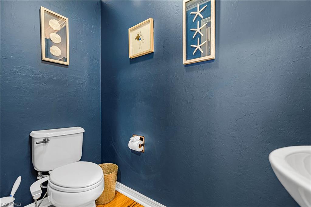 450 Bayfront Place, Unit 4202 Naples, FL 34102 - Photo 17 of 39 Bathroom featuring a textured wall and wood finished floors