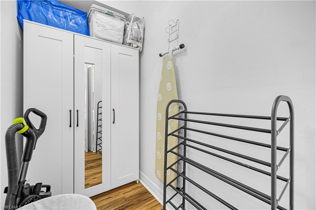 450 Bayfront Place, Unit 4202 Naples, FL 34102 - Photo 21 of 39 Bathroom featuring light wood finished floors and baseboards