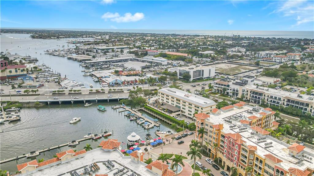450 Bayfront Place, Unit 4202 Naples, FL 34102 - Photo 29 of 39 Aerial view of property's location with a nearby body of water and a marina